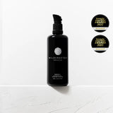 Black bottle of Wildcrafted Organics on a white background with awards displayed.