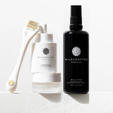 Collection of Wildcrafted Organics skincare products on a white background