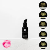 Black bottle with 'Wildcrafters' branding on a white background with multiple awards displayed.